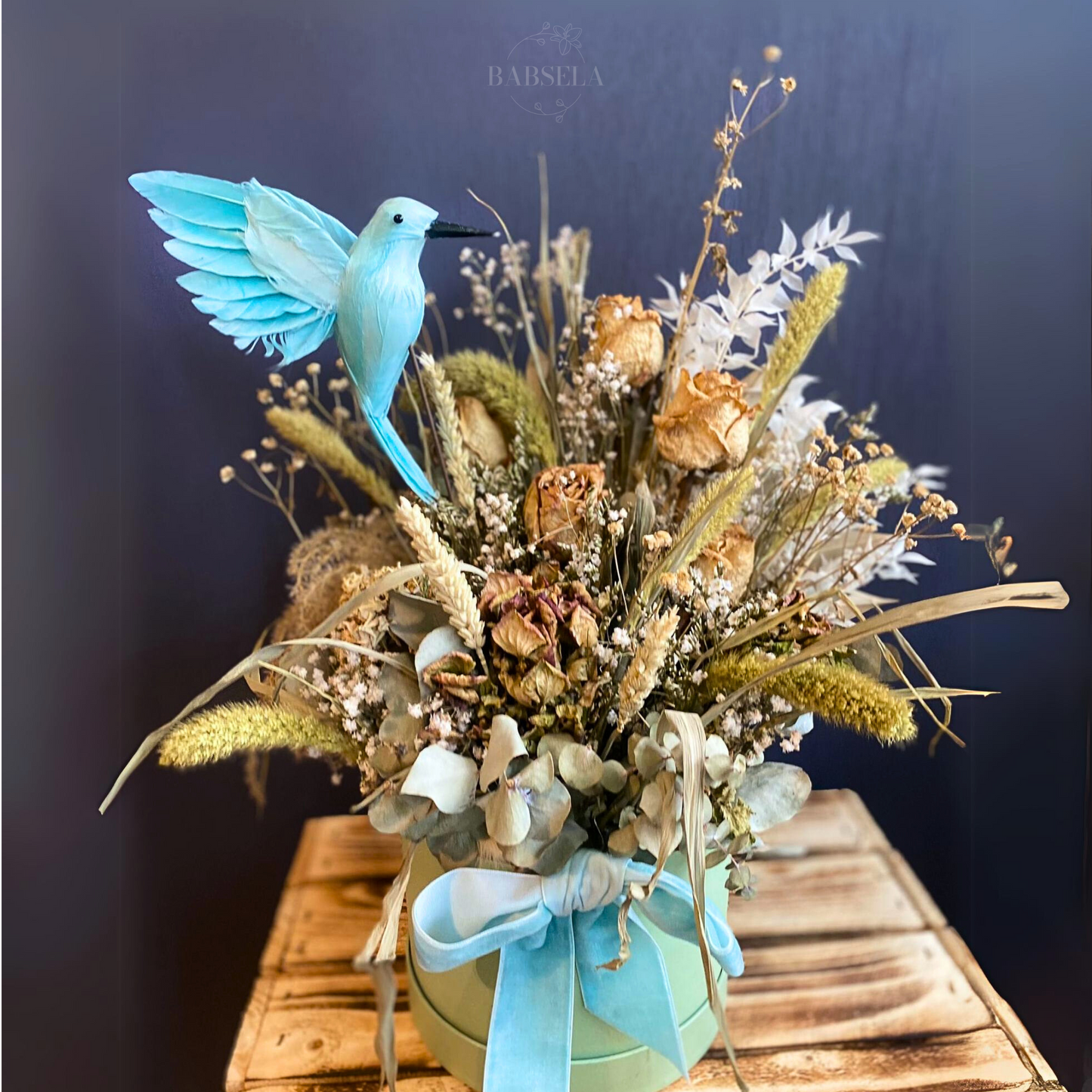 Bird of Paradise Bouquet from Babsela Florist Beckenham, featuring dried flowers and blue bird decor. Delivery available to Croydon and Bromley areas