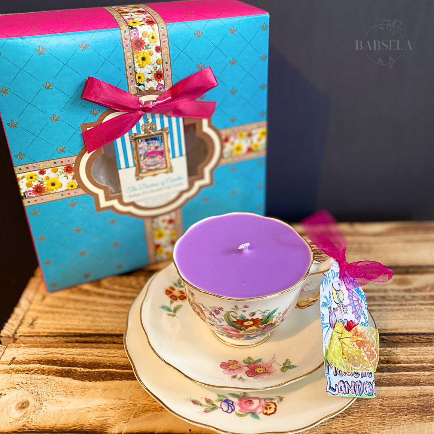 Vintage floral teacup set with lavender candle and decorative gift box, featuring a blue and pink floral-themed packaging